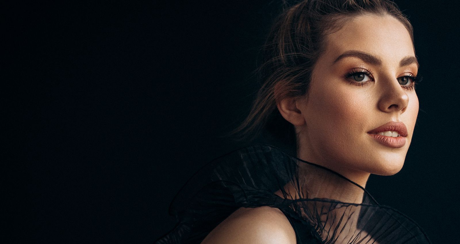 Portrait of woman with elegant hairstyle and makeup.