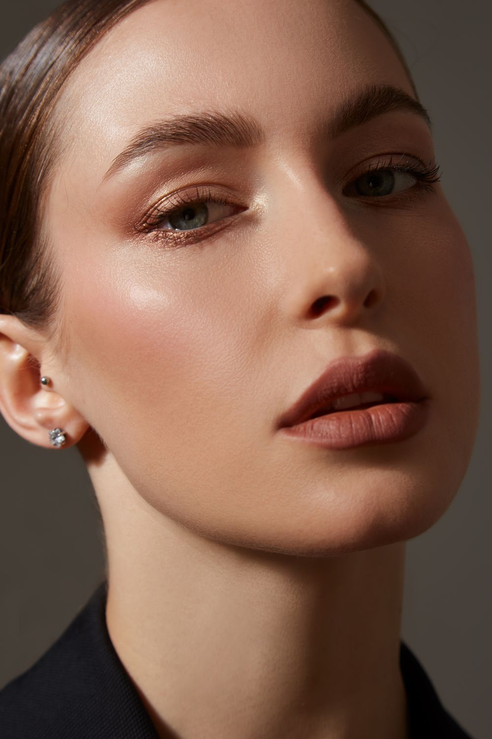 Close-up of a woman's elegant makeup look.