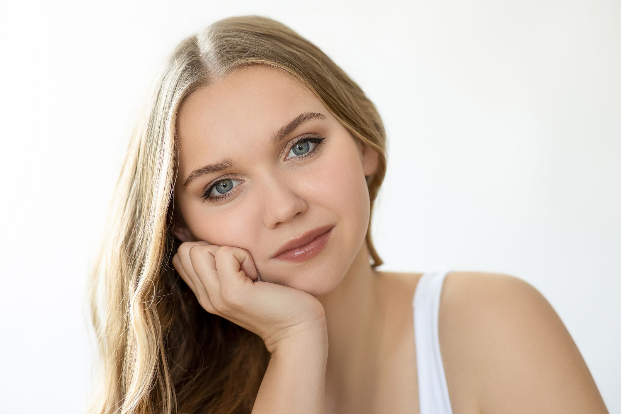 Portrait of a young woman with elegant expression.